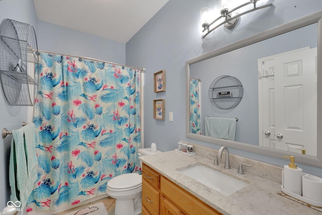 bathroom featuring tile patterned flooring, vanity, curtained shower, and toilet