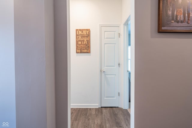 corridor featuring hardwood / wood-style floors