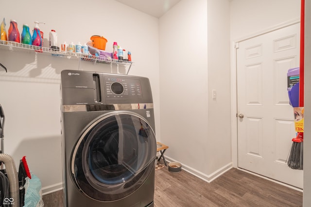 washroom featuring washer / clothes dryer and dark hardwood / wood-style flooring