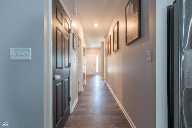 corridor featuring dark hardwood / wood-style flooring