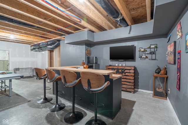 bar featuring concrete floors