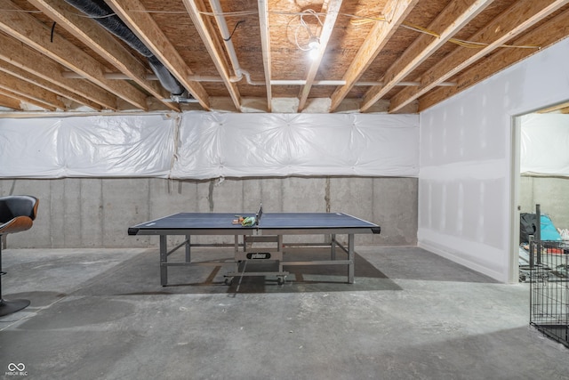 playroom featuring concrete flooring