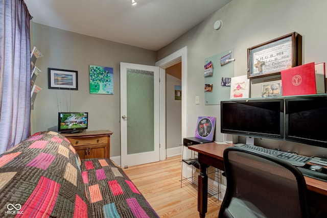 bedroom with light hardwood / wood-style floors