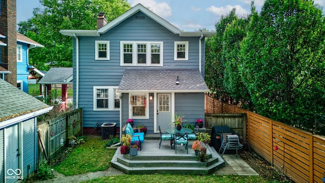 back of property featuring cooling unit and a deck