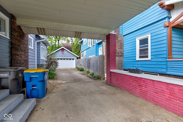 view of patio / terrace with an outbuilding and a garage