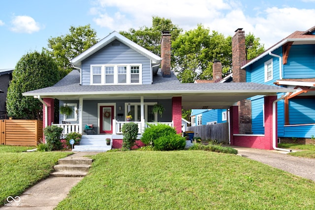 view of front facade with a front yard and a porch