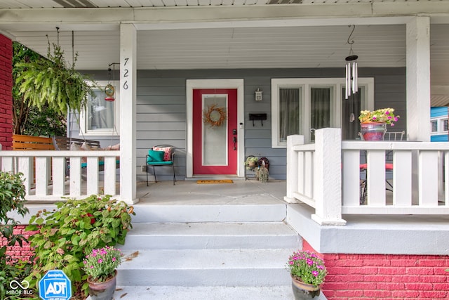 entrance to property with covered porch