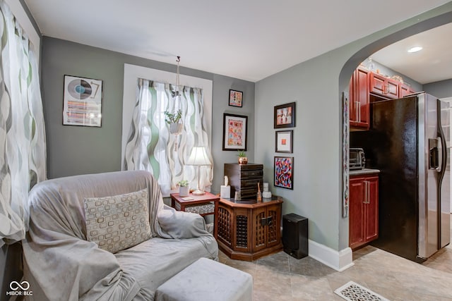 sitting room featuring light tile patterned floors