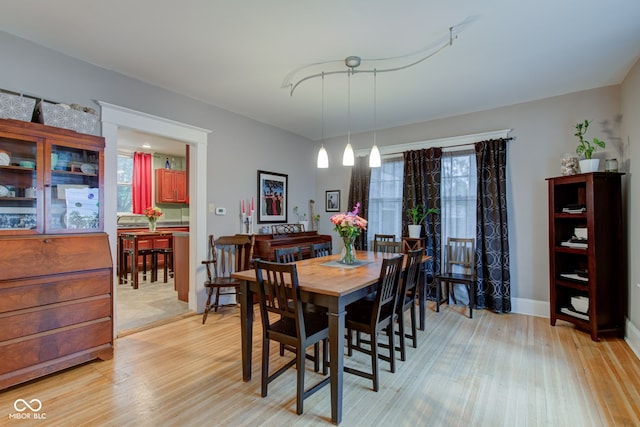 dining space featuring a healthy amount of sunlight and light wood-type flooring