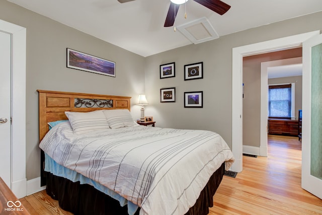 bedroom with ceiling fan and light wood-type flooring