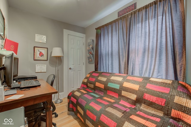 bedroom with light hardwood / wood-style flooring