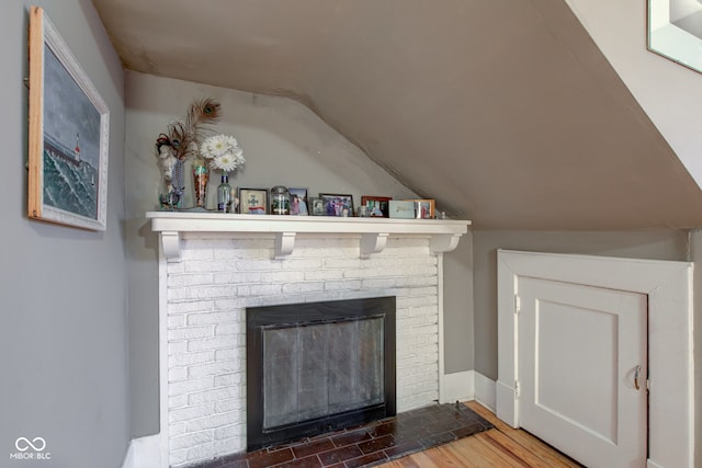 room details with wood-type flooring and a fireplace