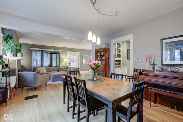 dining room with light hardwood / wood-style floors