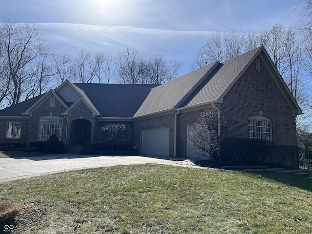 view of front of property featuring a garage and a front yard