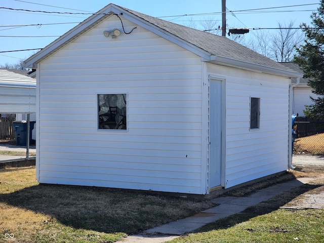 view of outbuilding featuring an outbuilding and fence