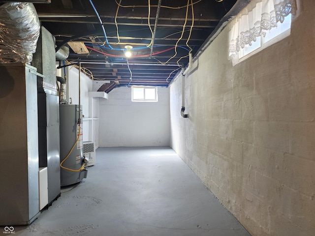 basement with heating unit and water heater