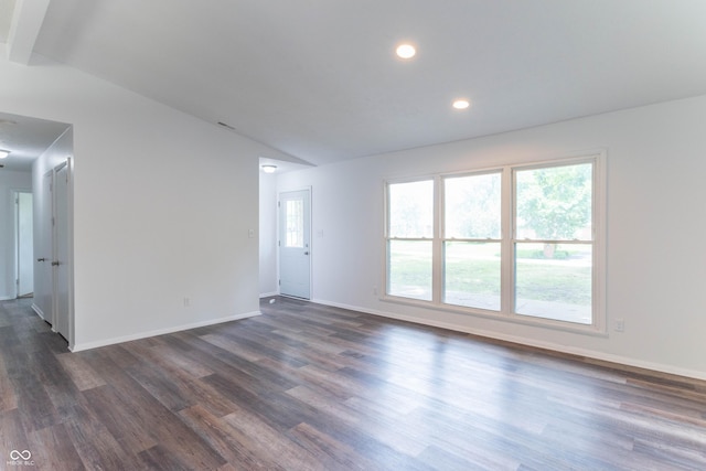 unfurnished room with vaulted ceiling, recessed lighting, baseboards, and dark wood-style flooring