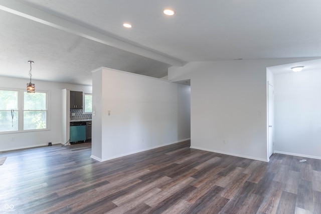 unfurnished living room with lofted ceiling with beams, baseboards, dark wood finished floors, and recessed lighting