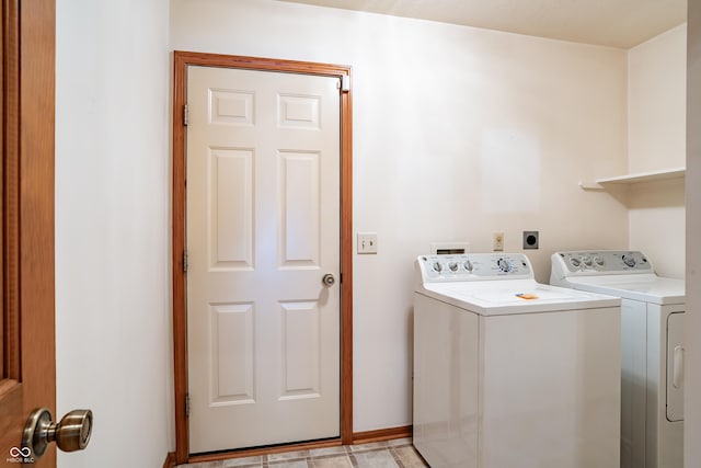 laundry room with washer and dryer and laundry area