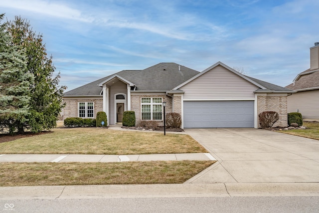 view of front of property with an attached garage, driveway, brick siding, and a front yard