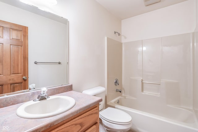 bathroom featuring shower / bathing tub combination, vanity, and toilet