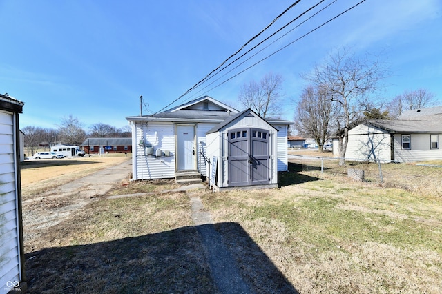 view of outbuilding featuring a yard