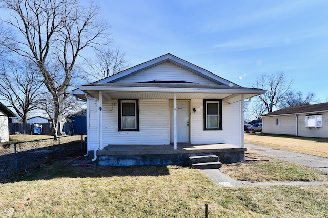 bungalow-style home featuring a porch and a front yard