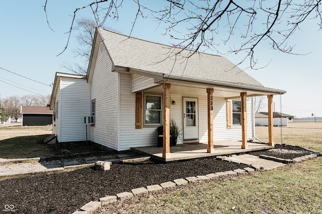 view of front of home featuring a porch and a shingled roof