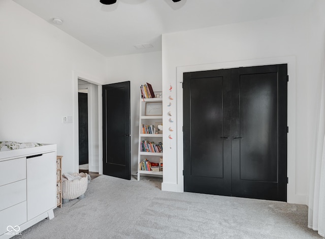 carpeted bedroom with ceiling fan