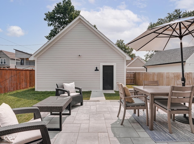 view of patio with a fenced backyard and outdoor dining area