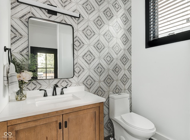 bathroom featuring toilet and vanity