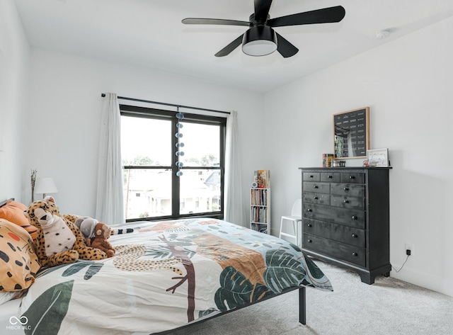 bedroom featuring ceiling fan, carpet floors, and baseboards