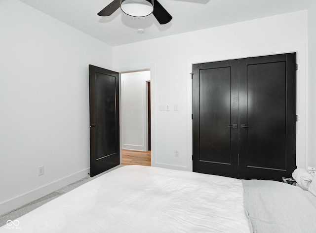 bedroom featuring a closet, ceiling fan, and baseboards