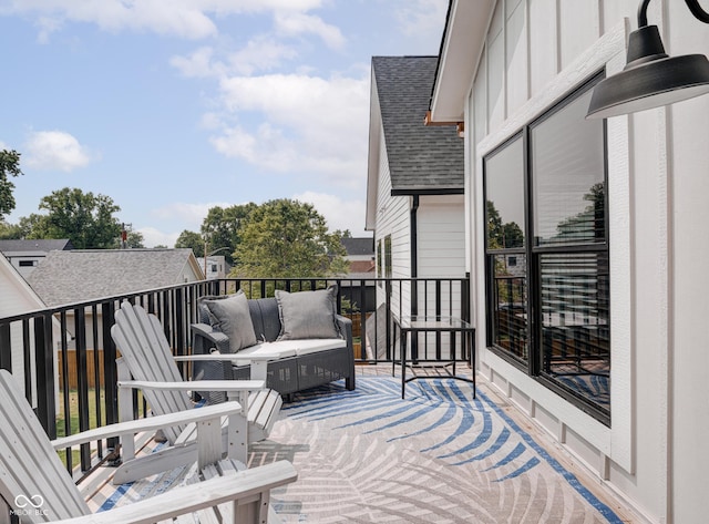 wooden terrace featuring an outdoor hangout area