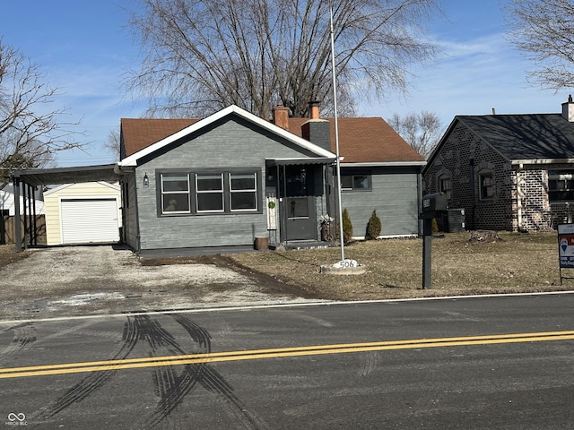 view of front of property with cooling unit and a carport