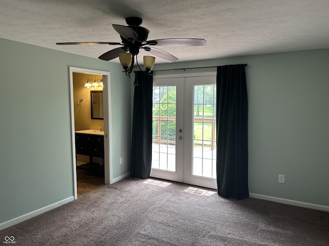 unfurnished bedroom featuring french doors, carpet flooring, ensuite bath, and access to exterior