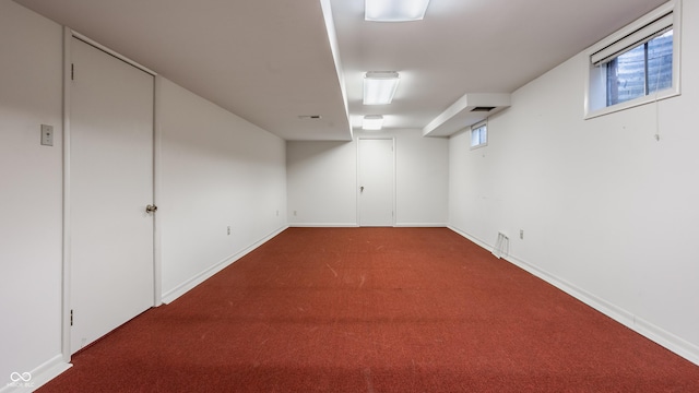 basement featuring carpet and baseboards