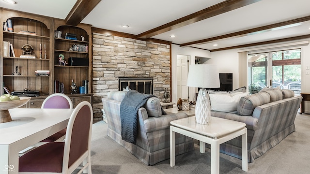 living room featuring beamed ceiling, a fireplace, and light colored carpet