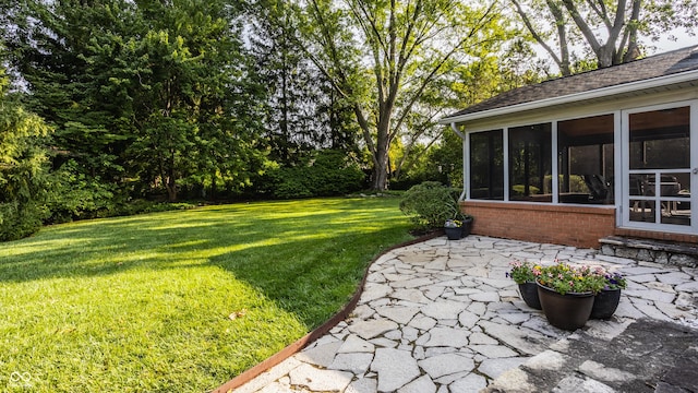 view of yard with a patio area and a sunroom