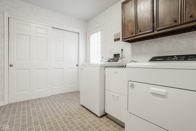 laundry room featuring cabinet space and washer and dryer