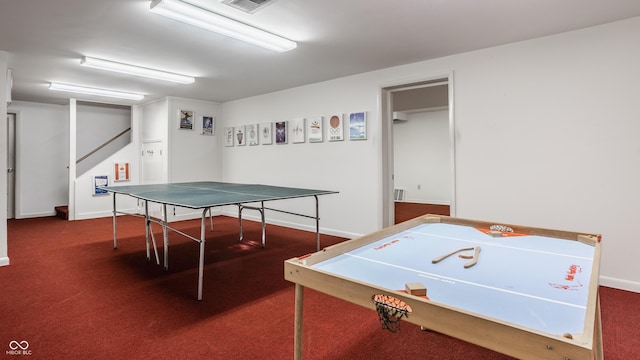 game room with baseboards and carpet floors