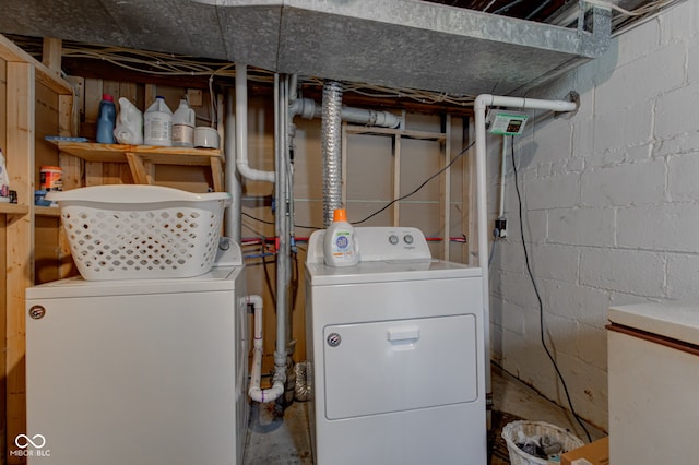 washroom featuring washing machine and dryer