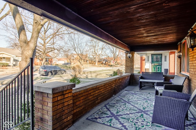 exterior space featuring outdoor lounge area and covered porch