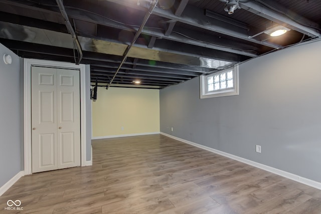 basement featuring hardwood / wood-style flooring