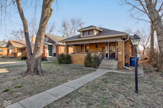 bungalow featuring a front yard and a porch