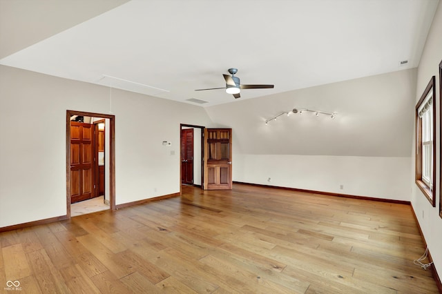 800 N 400 W, Bargersville, IN 46106 - empty room featuring attic access, vaulted ceiling, light wood finished floors, and a ceiling fan