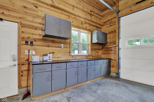 800 N 400 W, Bargersville, IN 46106 - kitchen featuring dark countertops, gray cabinetry, wooden walls, and unfinished concrete floors