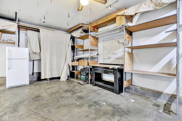 800 N 400 W, Bargersville, IN 46106 - basement featuring freestanding refrigerator, a workshop area, and ceiling fan