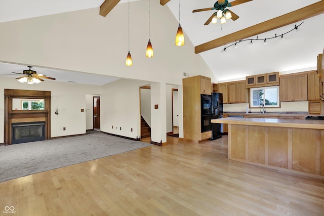 800 N 400 W, Bargersville, IN 46106 - kitchen featuring ceiling fan, black refrigerator with ice dispenser, open floor plan, high vaulted ceiling, and light wood-style floors