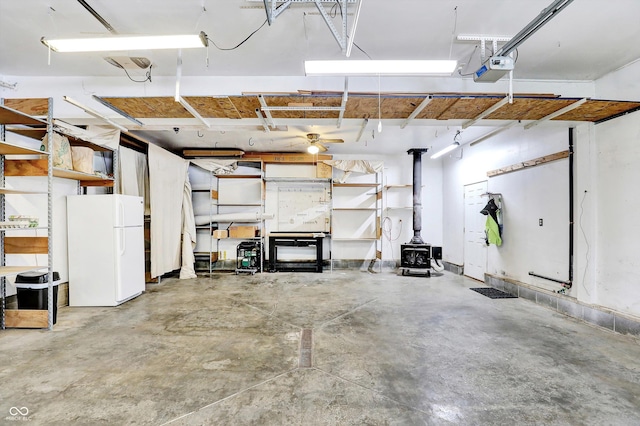 800 N 400 W, Bargersville, IN 46106 - garage with freestanding refrigerator, a wood stove, and a garage door opener